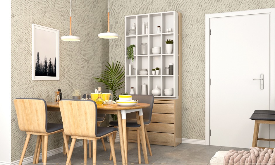 Dining room 1 bhk home has a four-seater dining table and a crockery unit with concealed storage